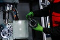 Quality control manufacturing.Hands of an engineer measures a metal part with a digital vernier caliper