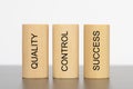 Quality, control and success printed on three pillars Royalty Free Stock Photo