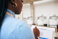 Quality control, woman and paperwork for a survey of food, fruit and produce in store. Notes, female person hands and Royalty Free Stock Photo