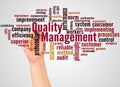 Quality Management word cloud and hand with marker concept Royalty Free Stock Photo