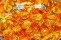 Quality Street toffee pennies. Popular chocolate sweets or candy made by Nestle in gold wrappers still in the tin.