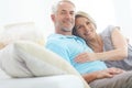 Quality time together. Portrait of a happy mature couple relaxing on the sofa at home. Royalty Free Stock Photo