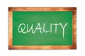 QUALITY word written on green school blackboard Royalty Free Stock Photo