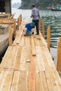 Quang Ninh, Vietnam - Mar 22, 2015: Vietnamese worker make wooden boat in Bai Tu Long bay, Ha Long city