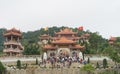 Quang Ninh, Vietnam - Mar 22, 2015: Wide exterior front view of Giac Tam zen monastery, Cai Bau pagoda in Van Don. Crowded people