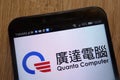 Quanta Computer logo displayed on a modern smartphone
