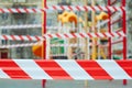 Quarantine Covid-19. Red warning tape on blurred empty playground background Royalty Free Stock Photo