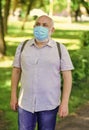 Quarantine extended. Mask protecting from virus. Pandemic concept. Limit risk infection spreading. Senior man face mask