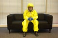 Quarantine - home arrest, man in protective uniform waiting. Royalty Free Stock Photo