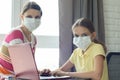 Quarantine mom and daughter do home lessons online Royalty Free Stock Photo