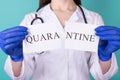 Quarantine is over free people freedom concept. Close-up cropped photo of female doctor in gloves holding parts of quarantine Royalty Free Stock Photo