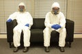 Quarantine. People in professional protective uniforms waiting for the end