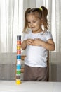 Quarantined girl built a tower of cans of paints