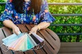 Quarantined woman choose colorful surgical masks to wear to prevent the spread of the CoronavirusCovid-19 Beautiful multi