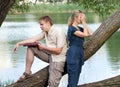 Quarrel.Young guy and girl with books