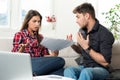 Quarreled couple with unpaid bills Royalty Free Stock Photo