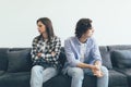 Quarreled young couple sitting on the sofa in their living room Royalty Free Stock Photo