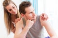 Arguing young couple, man is huffy and remains silent Royalty Free Stock Photo