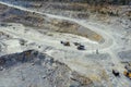 Quarry equipment for extraction and transportation of granite, dump trucks and excavators Royalty Free Stock Photo