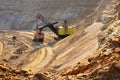 Quarry excavator loading sand or into dump truck at opencast Royalty Free Stock Photo