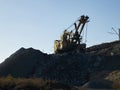 Quarry excavator working near railroad Royalty Free Stock Photo