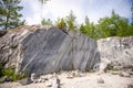 A quarry for the extraction of marble. A rock made of marble. Pyramids of stones Royalty Free Stock Photo