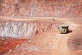 Quarry mine of porphyry rock. dumper truck driving around