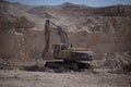 Quarry Mining excavators working on breaking the rocks Royalty Free Stock Photo