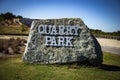 The Quarry Park large gray and white rock sign