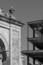 quarry stone arch architecture, in contrast with a steel building next door, Royalty Free Stock Photo