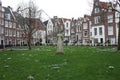 The quarter of the Beguines of Amstedam. Beguinage in the secret garden of the Beguines in Amsterdam on a winter day