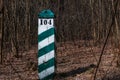 Quarter pillar in the forest. A pillar for a landmark in the forest. Royalty Free Stock Photo