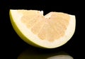 Quarter of pomelo, chinese grapefruit isolated on black Royalty Free Stock Photo