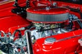 Quarter view of a streetrod engine with red air filter, valve covers Royalty Free Stock Photo