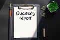 Quarterly report is shown using a text Royalty Free Stock Photo