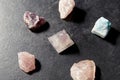 Quartz crystal pyramid and gem stones on slate Royalty Free Stock Photo