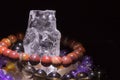 Quartz geode with semiprecious gemstone bracelets charging, spirituality concept, alternative medicine