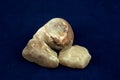 Quartz Stones From a Beach on a Blue Background Royalty Free Stock Photo