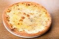 Quattro formaggi is a variety of Italian pizza topped with: mozzarella, gorgonzola, parmesan Royalty Free Stock Photo