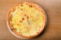 Quattro formaggi is a variety of Italian pizza topped with: mozzarella, gorgonzola, parmesan Royalty Free Stock Photo