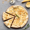 Quattro fromaggi pizza cutted into slices, top view Royalty Free Stock Photo