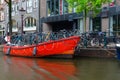 Quay of canal in historic center of city, typical urban view, Amsterdam, North Holland, Netherlands