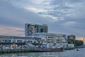 Quay, sheds, factory and sky at sunset Royalty Free Stock Photo