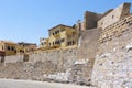 Quay wall and above it the colored houses next to the Firka Venetian Fortress in the Old Venetian Port of Chania, Crete, Greece Royalty Free Stock Photo