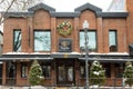 Restaurant Montego facade with trees decorated for the winter season at 1460 Maguire avenue