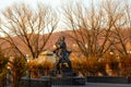 Selective focus view of a 1926 Jacques Cartier statue seen during a fall golden hour morning
