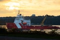 The CCGS Vincent Massey Coast Guard boat seen on the St. Lawrence River during a summer sunrise Royalty Free Stock Photo