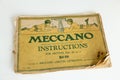 Vintage 1920s weathered Meccano set instructions on pale background