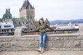 Quebec City scape with Chateau Frontenac and young teen enjoying the view. Royalty Free Stock Photo