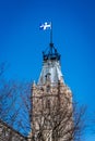 Quebec flag flying over parliament building on a sunny spring morning. Royalty Free Stock Photo